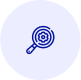Magnifying glass focusing on a target with concentric circles.
